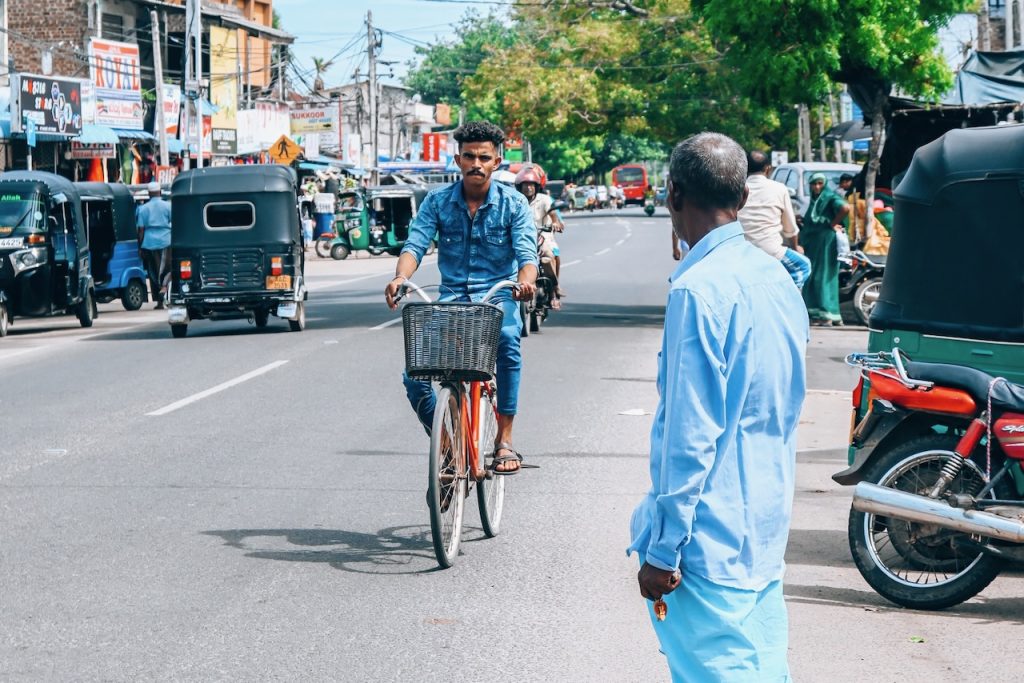 Man riding his bicycle along the street in Sri Lanka