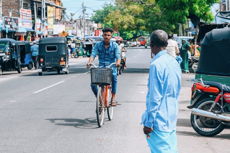 Man riding his bicycle along the street in Sri Lanka