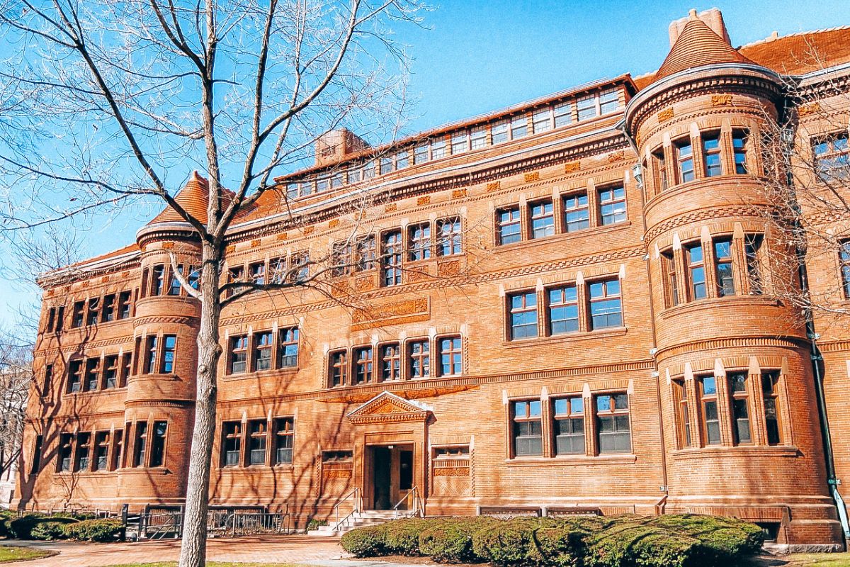 Discover Unique Things to do in Boston in 2 days: Historic brick building with large windows and towers at Harvard University in Boston, Massachusetts.