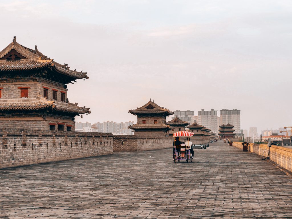 How to spend 48 Hours in Xi'An: Cyclists on Xian City Wall at Sunset